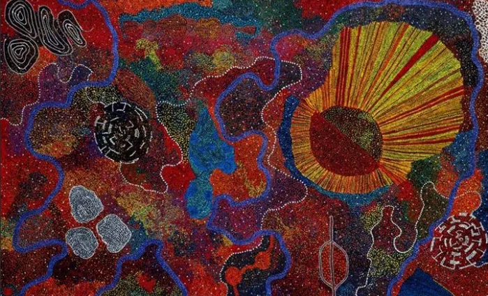 'My Mother's Creation' by Ms Weir: a richly dotted painting in deep reds and blues with a radiating golden sun, waterways and Country